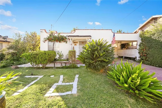 a view of a swimming pool with a yard