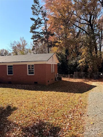 a view of backyard with large trees