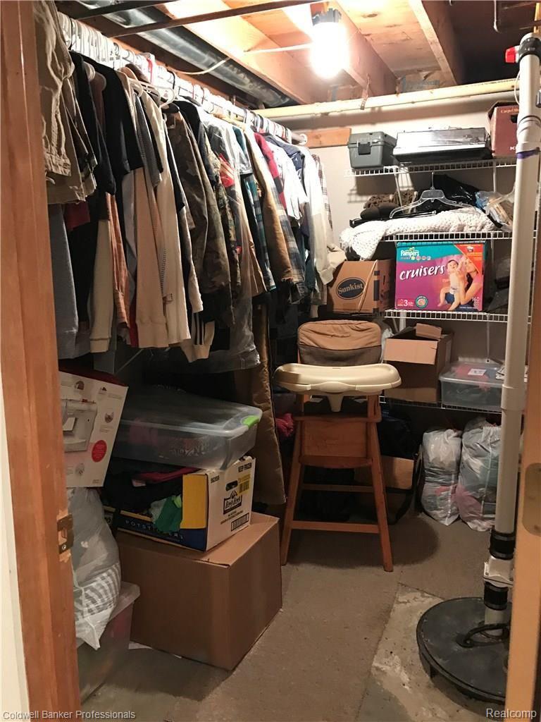 301 East Road Holly, MI 48442 - Photo 25 of 34 Basement storage room