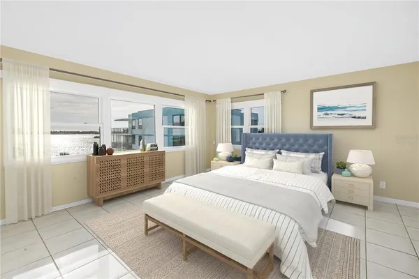 a large bedroom with a bed and glass windows