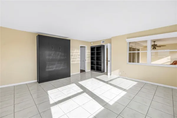 a view of an empty room with a window