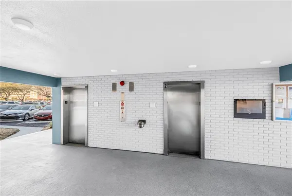 a view of empty room with a white door