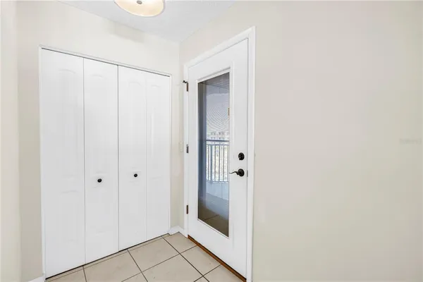 a bathroom with a glass shower door