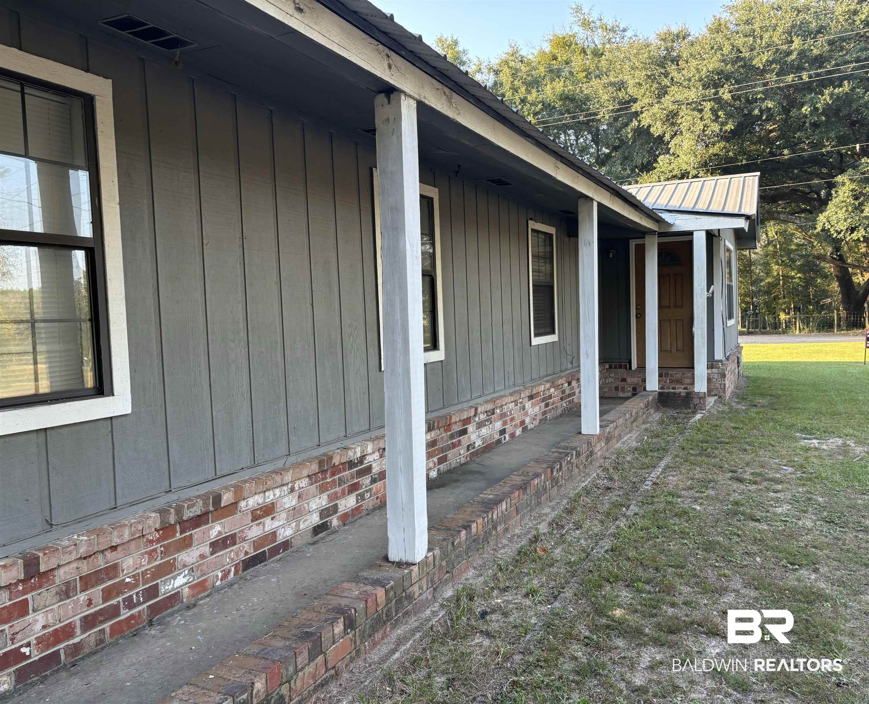 17495 County Road 48 Robertsdale, AL 36567 - Photo 5 of 37 View of home's exterior with a yard