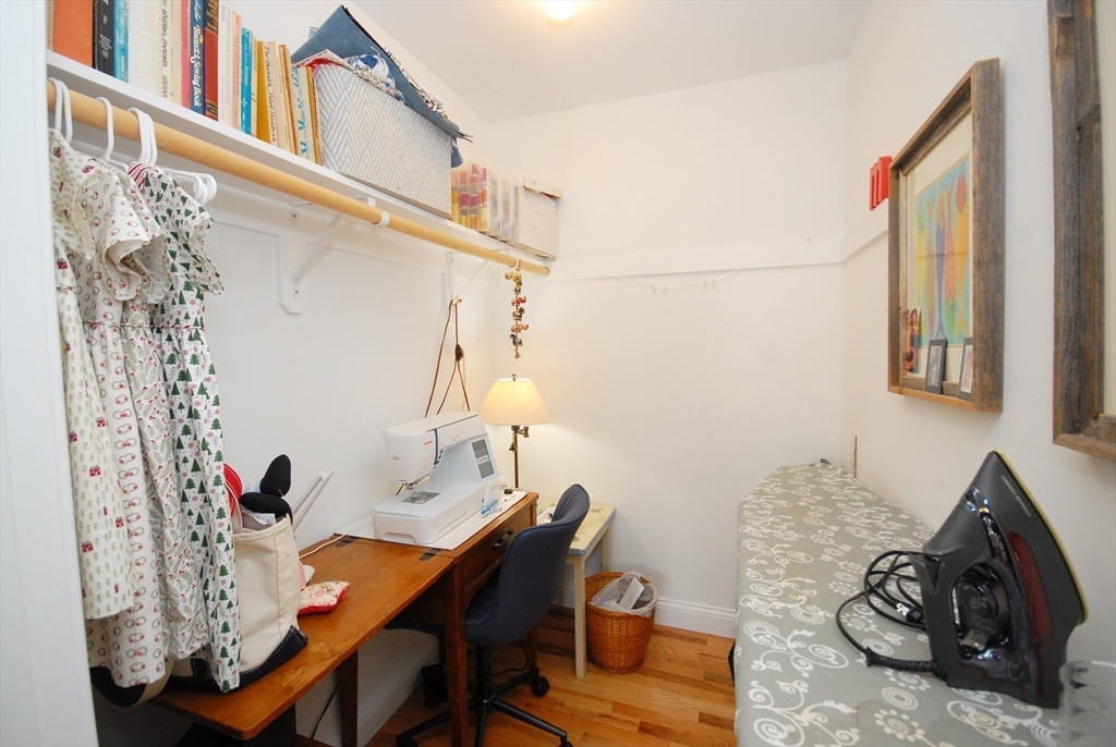 22 B Blacksmith Row, Unit B Groton, MA 01450 - Photo 23 of 24 a view of a dining room with furniture and wooden floor