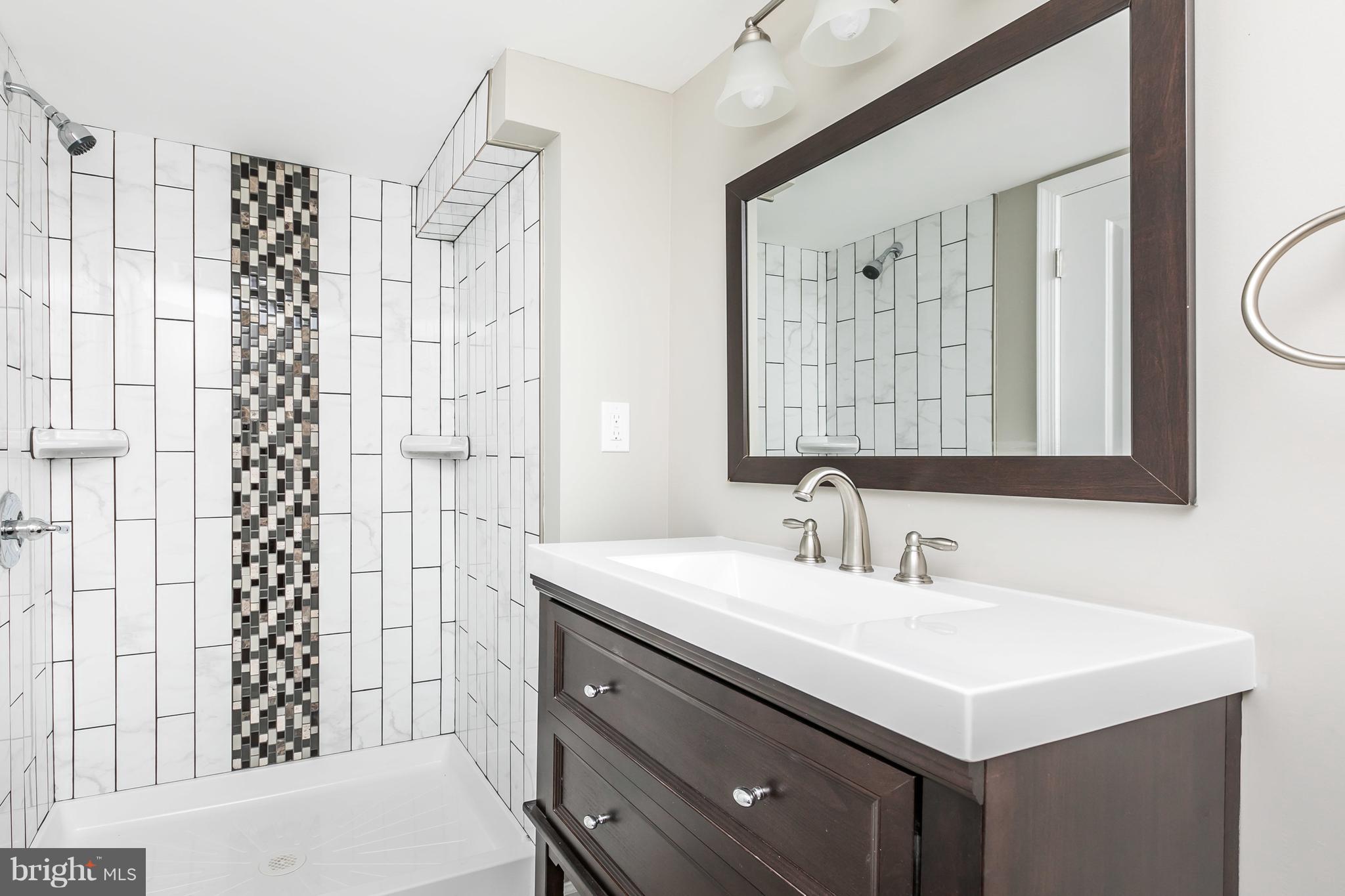 1816 Aberdeen Road Towson, MD 21286 - Photo 22 of 30 a bathroom with a sink double vanity and a shower