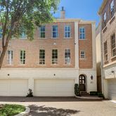 a front view of a building with a garden
