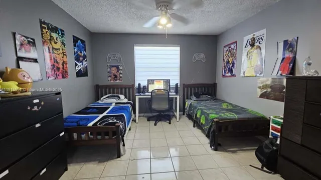 a bedroom with furniture and a baby crib