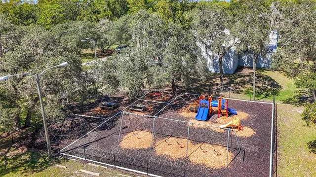 a view of a swimming pool with an outdoor space and seating area