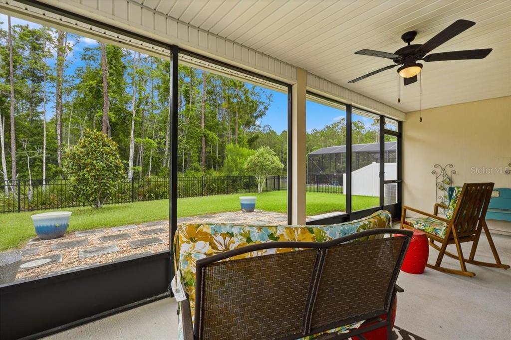 35 Birdie Way Bunnell, FL 32110 - Photo 43 of 57 a view of a porch with furniture and a yard