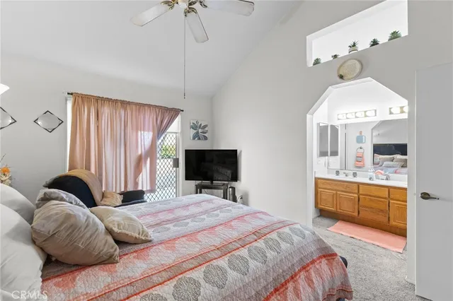 a bedroom with a bed and a mirror