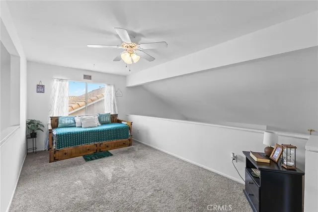 a bedroom with furniture and a window