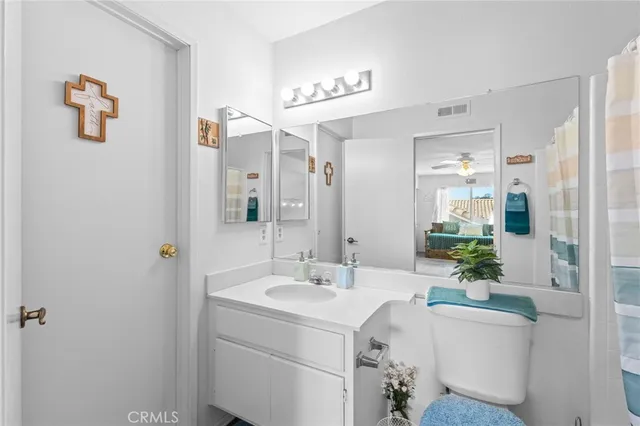 a bathroom with a sink a mirror and a shower