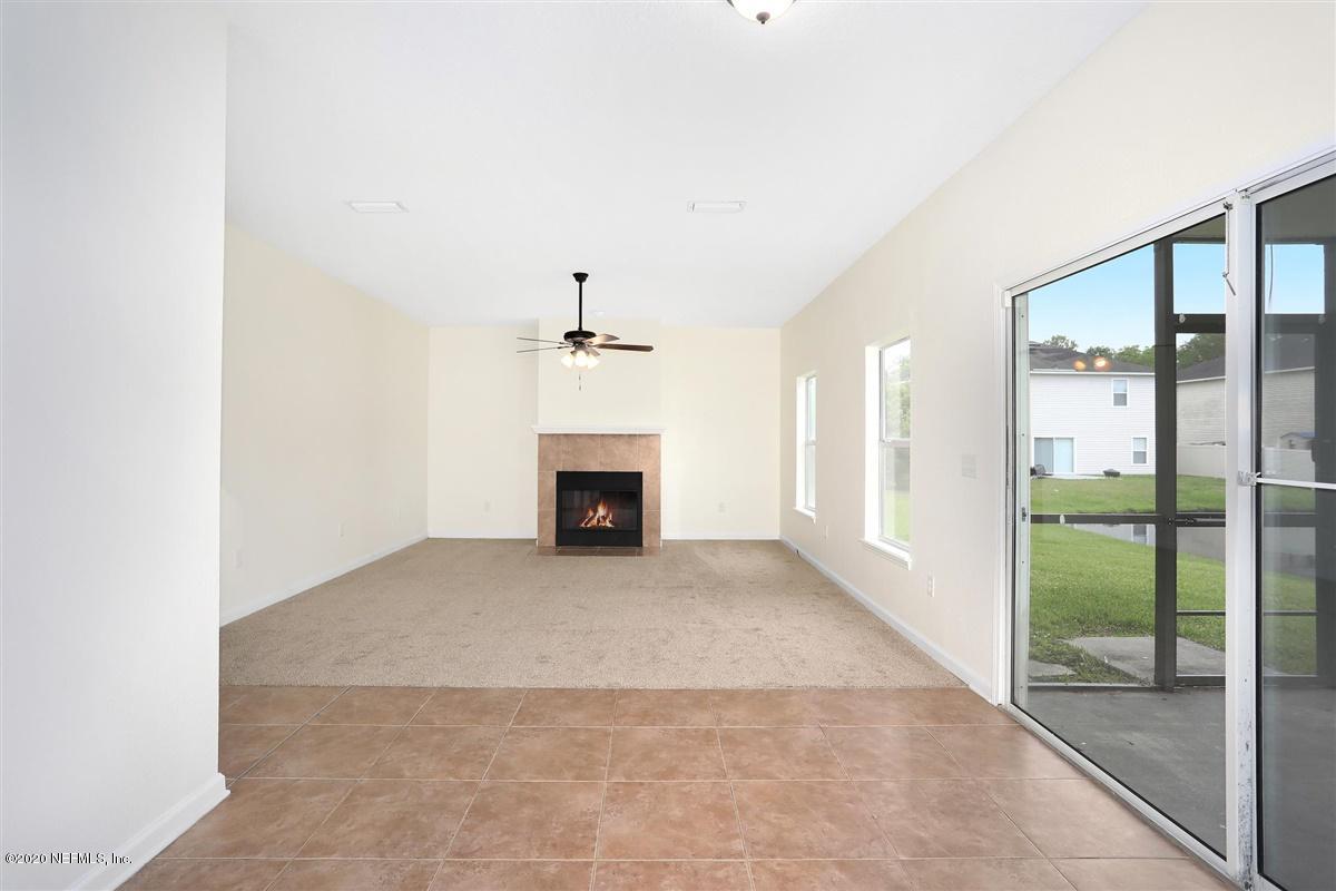 7177 Rampart Ridge Circle West Jacksonville, FL 32244 - Photo 8 of 20 a view of empty room with floor to ceiling window