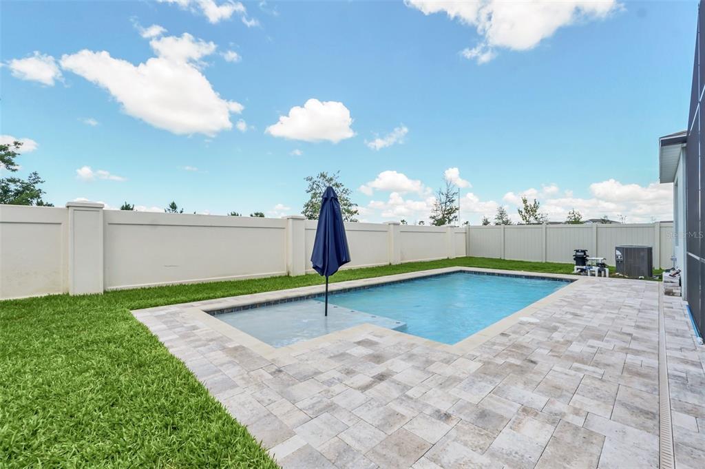 2001 Spring Shower Circle Kissimmee, FL 34744 - Photo 25 of 25 a swimming pool with trees in the background