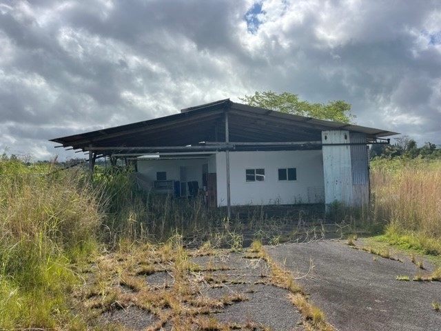18-3989 South Lauko Road Mountain View, HI 96771 - Photo 12 of 12 a front view of a house with a yard