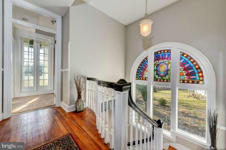 2304 Hillhouse Road Baltimore, MD 21207 - Photo 15 of 30 Original staircase w/ stained glass window