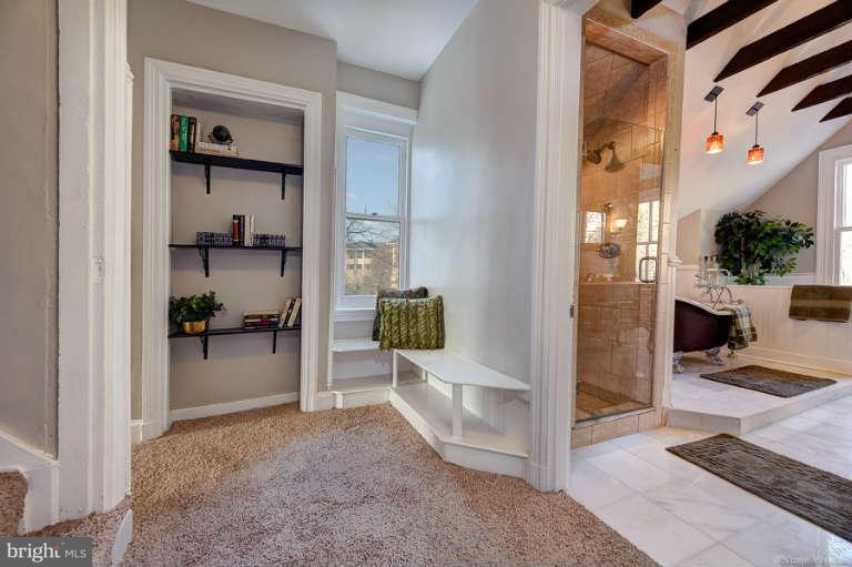 2304 Hillhouse Road Baltimore, MD 21207 - Photo 21 of 30 Interior hallway with built-in shelves and bench