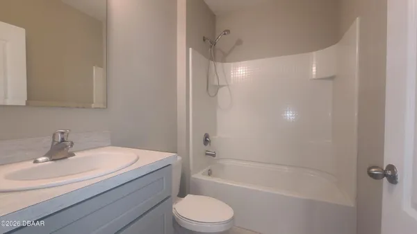 a bathroom with a sink toilet and bathtub