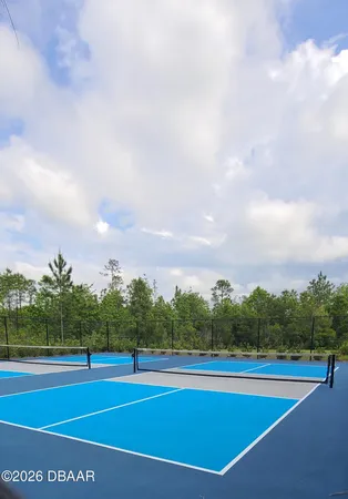 a view of an outdoor space and tennis court