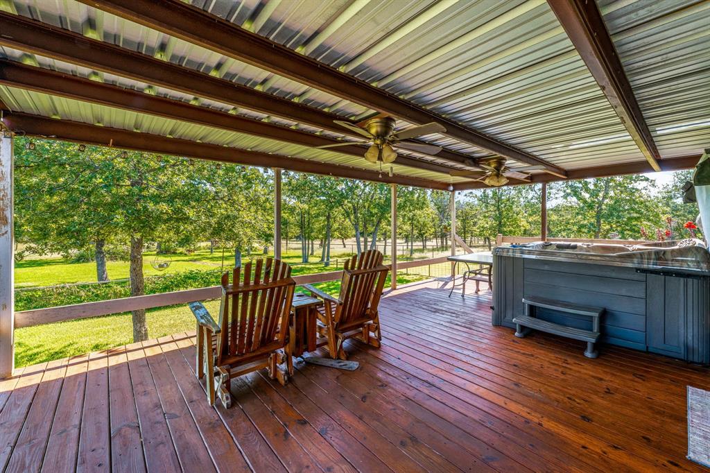 1071 Grimes Road Mineral Wells, TX 76067 - Photo 12 of 25 a view of a chairs and table on the wooden floor