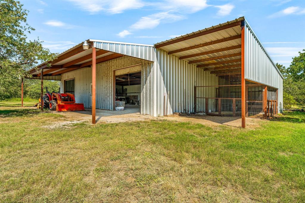 1071 Grimes Road Mineral Wells, TX 76067 - Photo 16 of 25 a view of a house with backyard and porch
