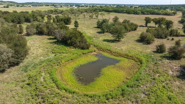 a view of lake with green space