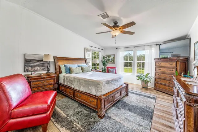 a bedroom with a bed and a couch