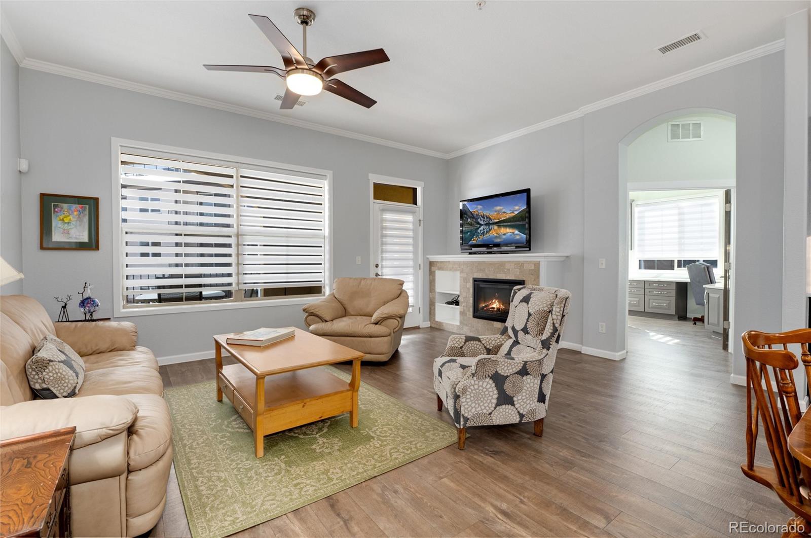 2366 Primo Road, Unit 203 Highlands Ranch, CO 80129 - Photo 13 of 35 a living room with furniture or couch and a wooden floor