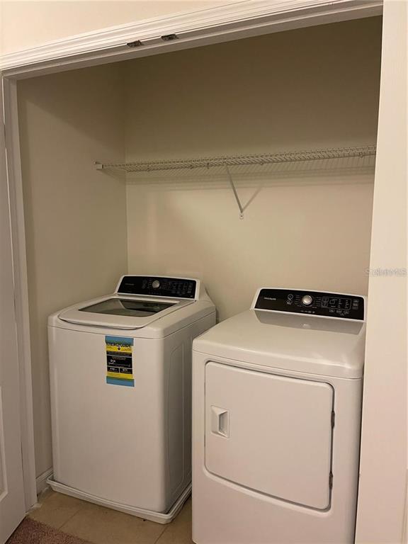 268 Arbor Lakes Drive Davenport, FL 33896 - Photo 14 of 26 a utility room with dryer and washer