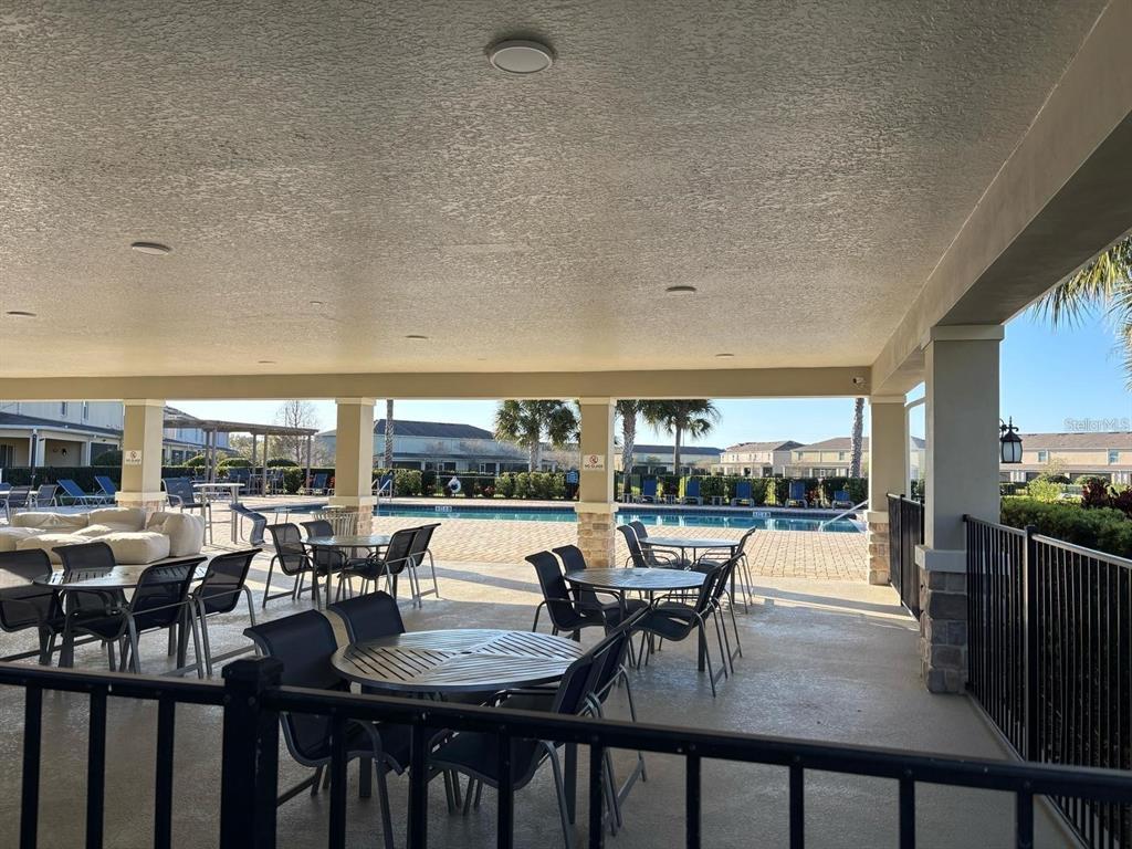 268 Arbor Lakes Drive Davenport, FL 33896 - Photo 24 of 26 a view of a dining room with furniture and wooden floor