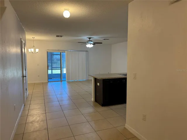 a view of an empty room with a bathroom
