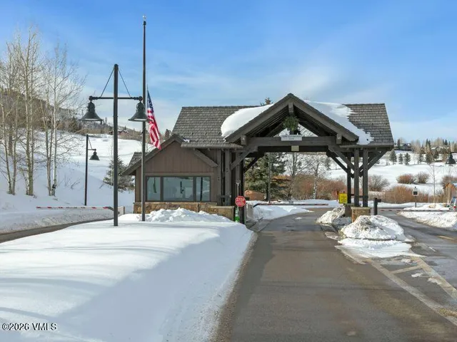 a front view of a house with sitting area