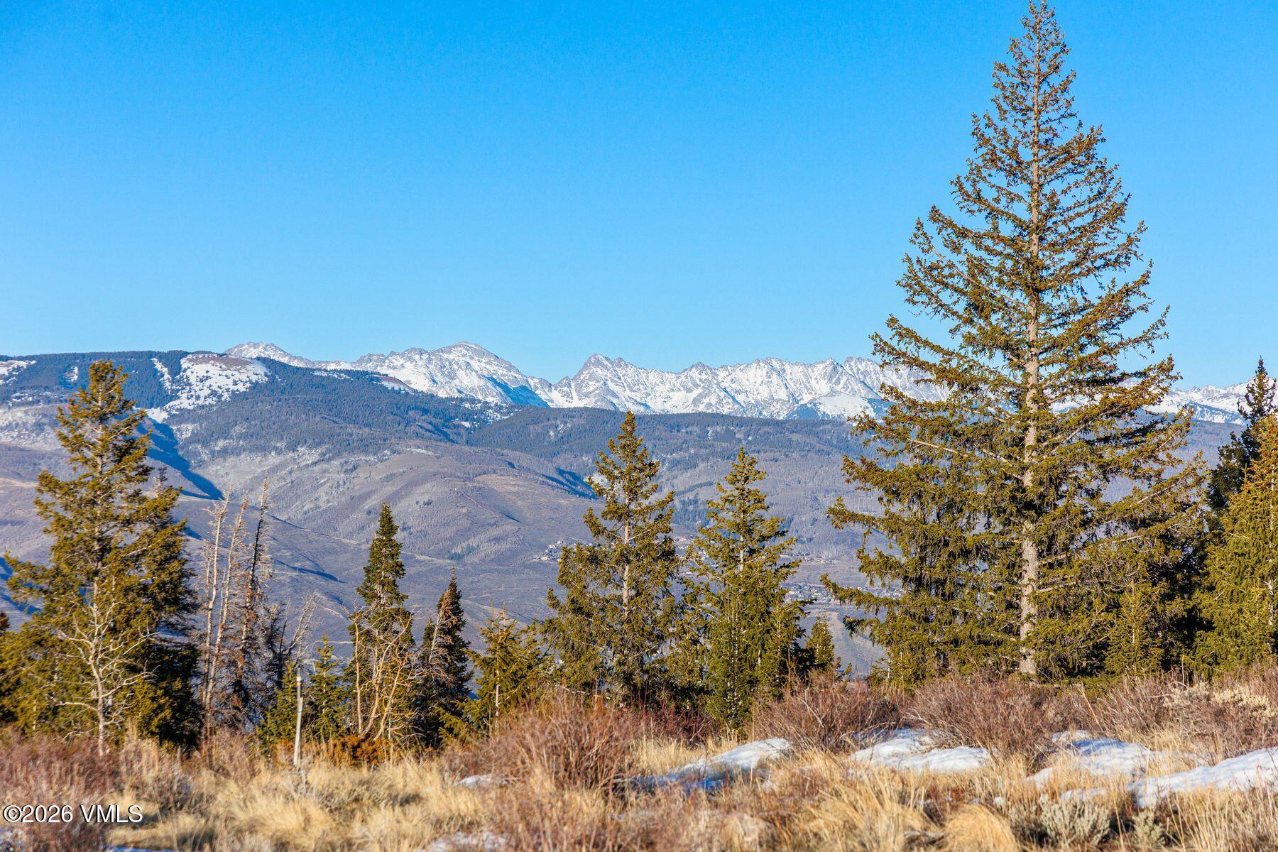 1279 Gore Trail Edwards, CO 81632 - Photo 7 of 18 a view of a houses with a mountain in the background
