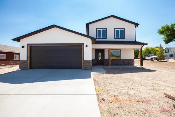 a front view of a house with yard