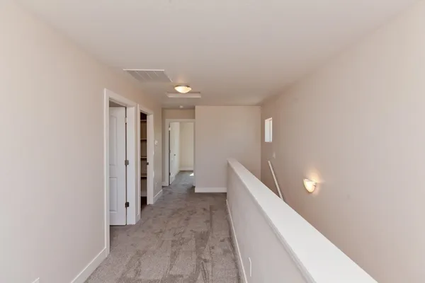a view of a hallway with closet
