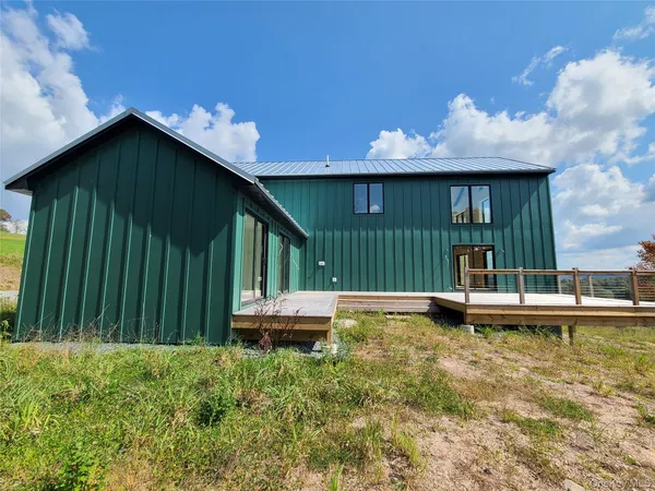 a view of a kitchen with furniture and a window