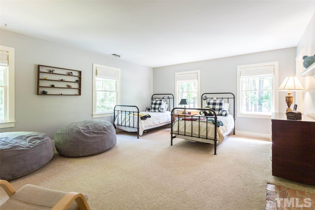 11809 Appaloosa Run East Raleigh, NC 27613 - Photo 22 of 30 This generous second floor bedroom with smooth ceilings is painted in a beautiful neutral color and has 4 single windows to let in plenty of natural light. Though not operable, this lovely room features a cozy masonry fireplace for added beauty.