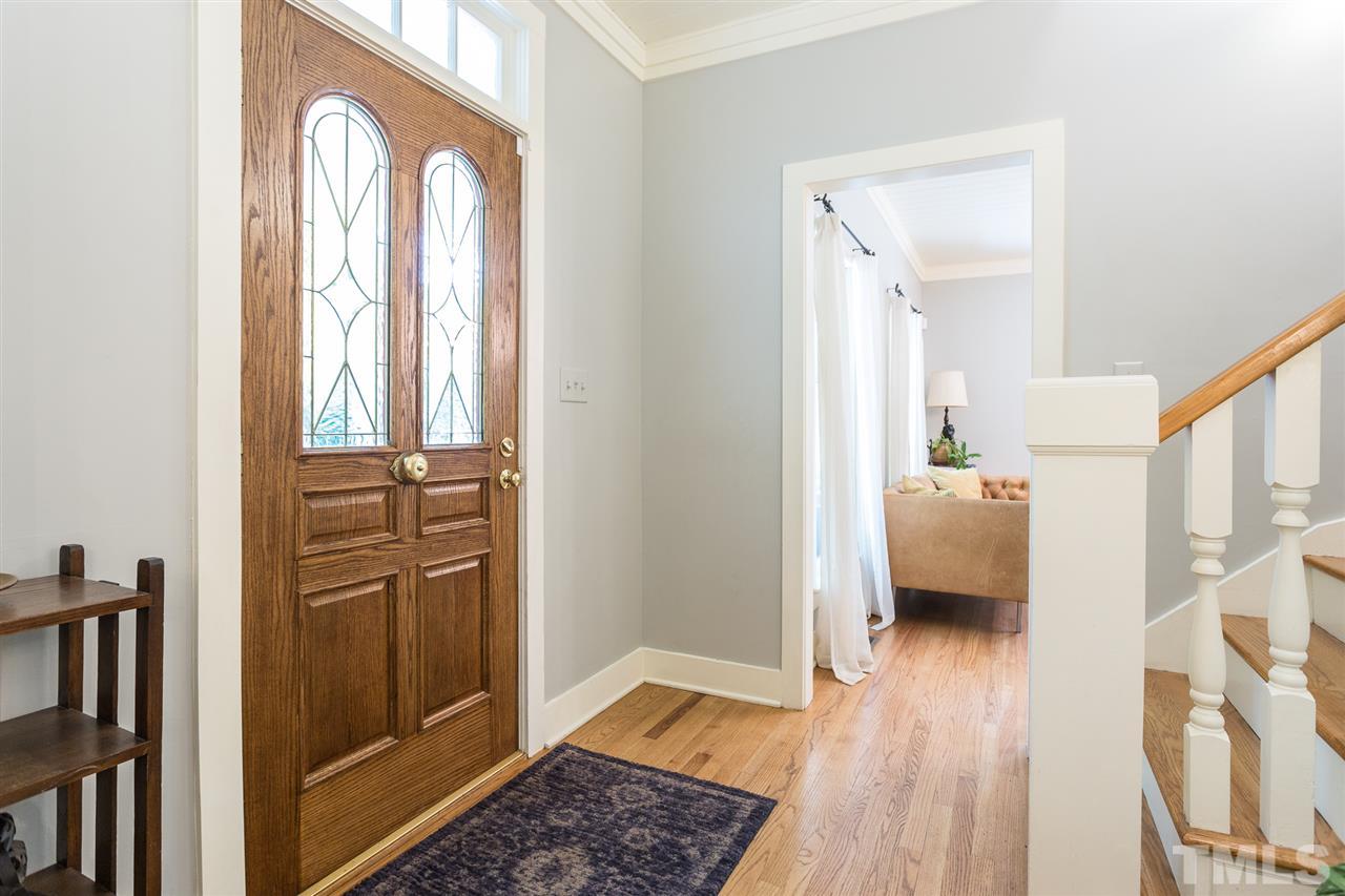 11809 Appaloosa Run East Raleigh, NC 27613 - Photo 4 of 30 This lovely entry foyer boasts gorgeous hardwood floors, wood treads on the staircase and a transom window above the front entrance.