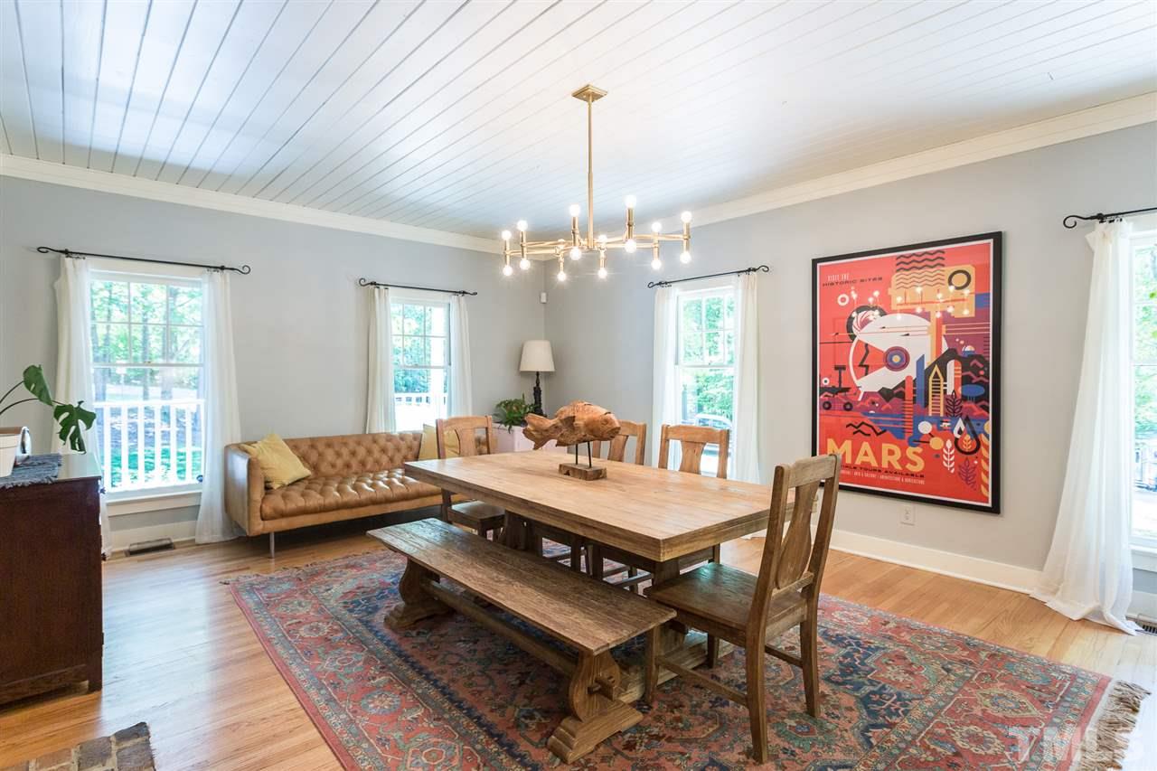11809 Appaloosa Run East Raleigh, NC 27613 - Photo 9 of 30 You will enjoy entertaining guests in this large and open dining area. Room is graced with gleaming hardwood floors, and lovely painted wood ceiling with an upgraded light fixture and lovely crown molding.