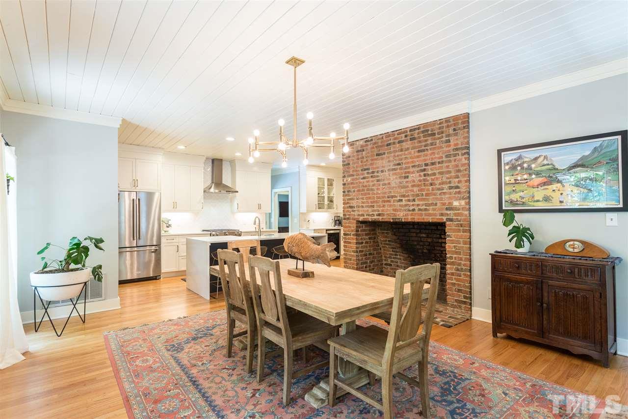 11809 Appaloosa Run East Raleigh, NC 27613 - Photo 10 of 30 This open and inviting dining room is graced with a beautiful masonry fireplace and painted wood ceilings. Gleaming hardwood floors add to the beauty of this elegant room.