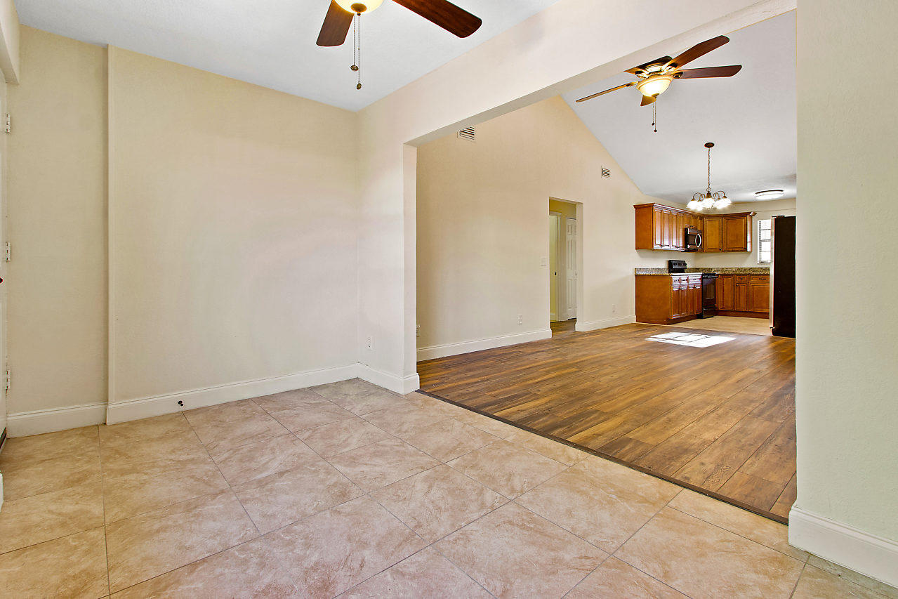 5903 Southeast Mitzi Lane Stuart, FL 34997 - Photo 11 of 22 a view of a kitchen with a sink and cabinet area