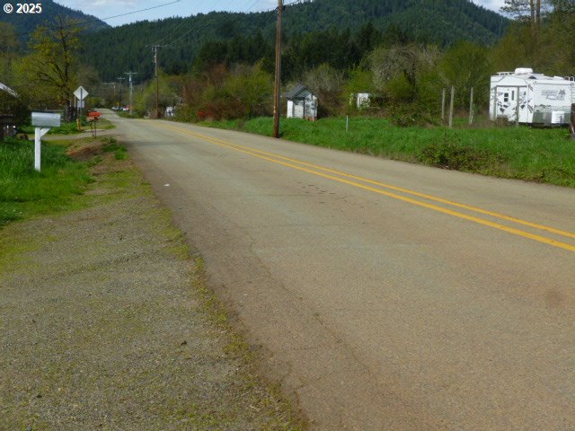 765 Tunnel Road Glendale, OR 97442 - Photo 5 of 17 a view of a street with a houses
