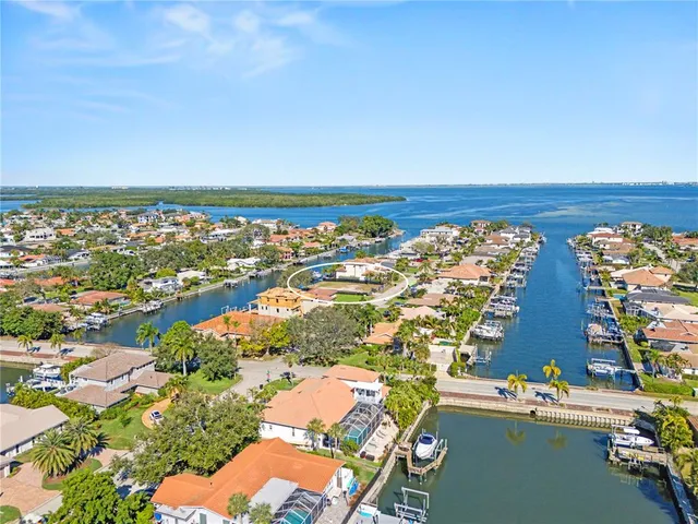 an aerial view of residential building and lake