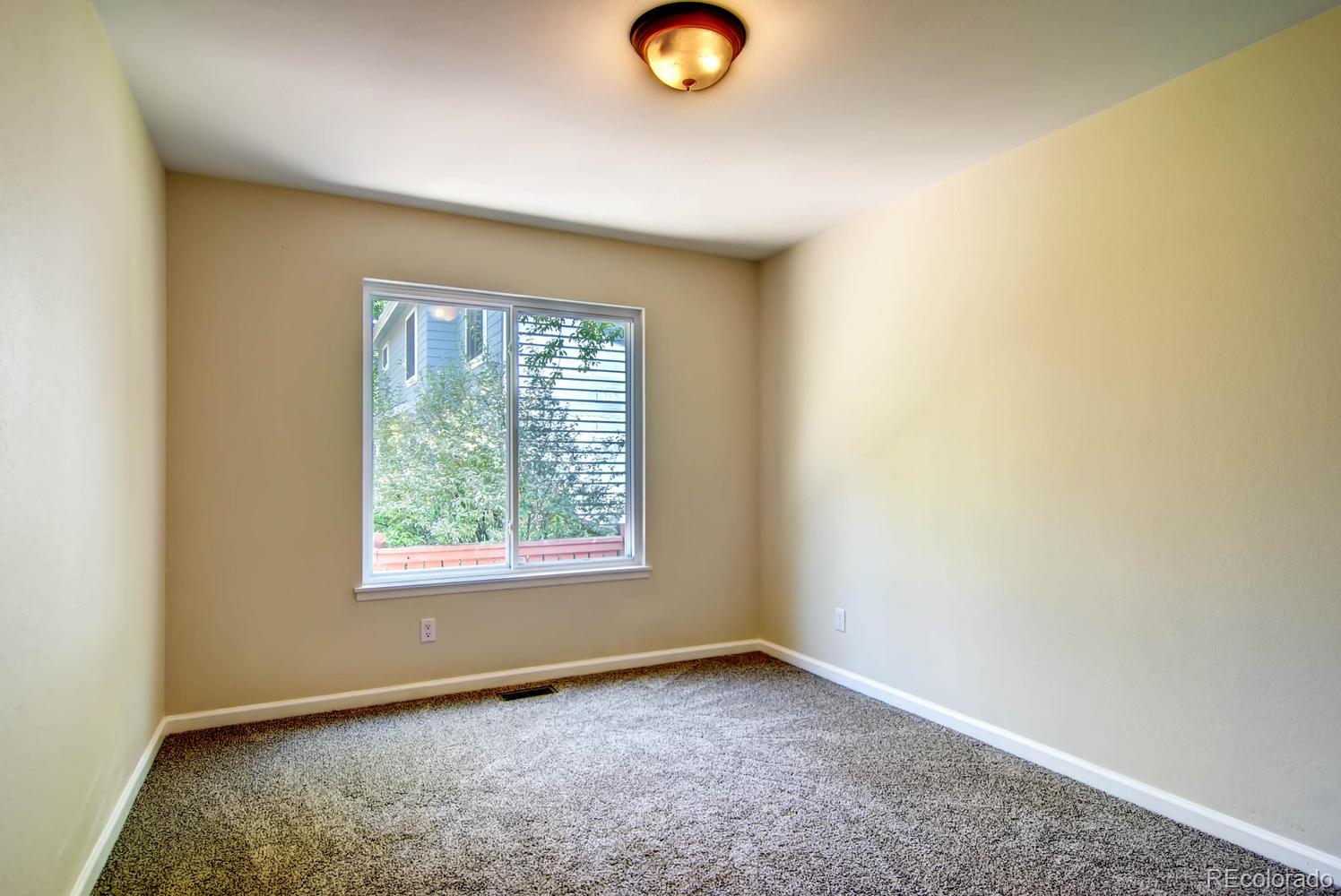3 Jack Rabbit Place Highlands Ranch, CO 80126 - Photo 19 of 28 an empty room with window