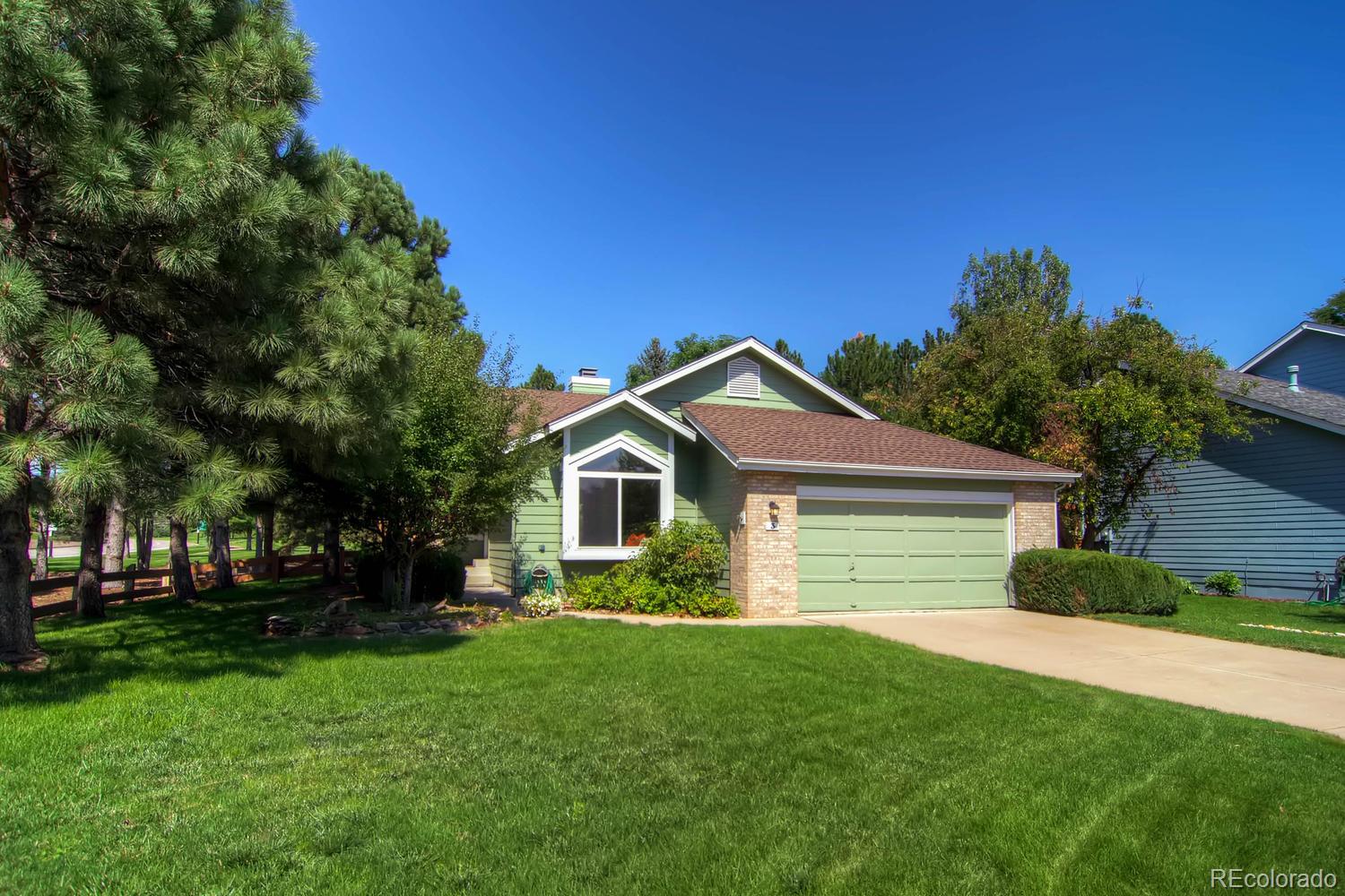 3 Jack Rabbit Place Highlands Ranch, CO 80126 - Photo 3 of 28 a front view of a house with a garden