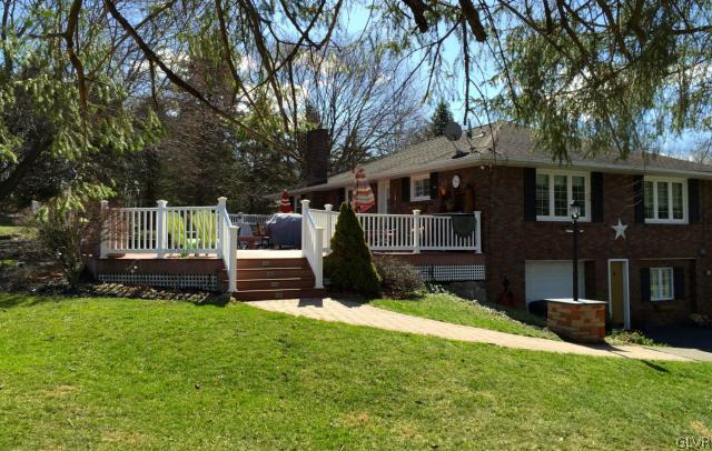 View from left of home showing entertaining deck,