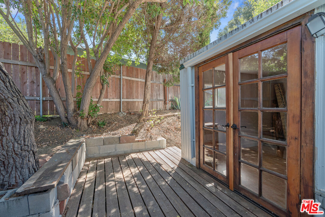 1667 Las Virgenes Canyon Road, Unit 9 Calabasas, CA 91302 - Photo 11 of 29 a view of backyard with a large tree