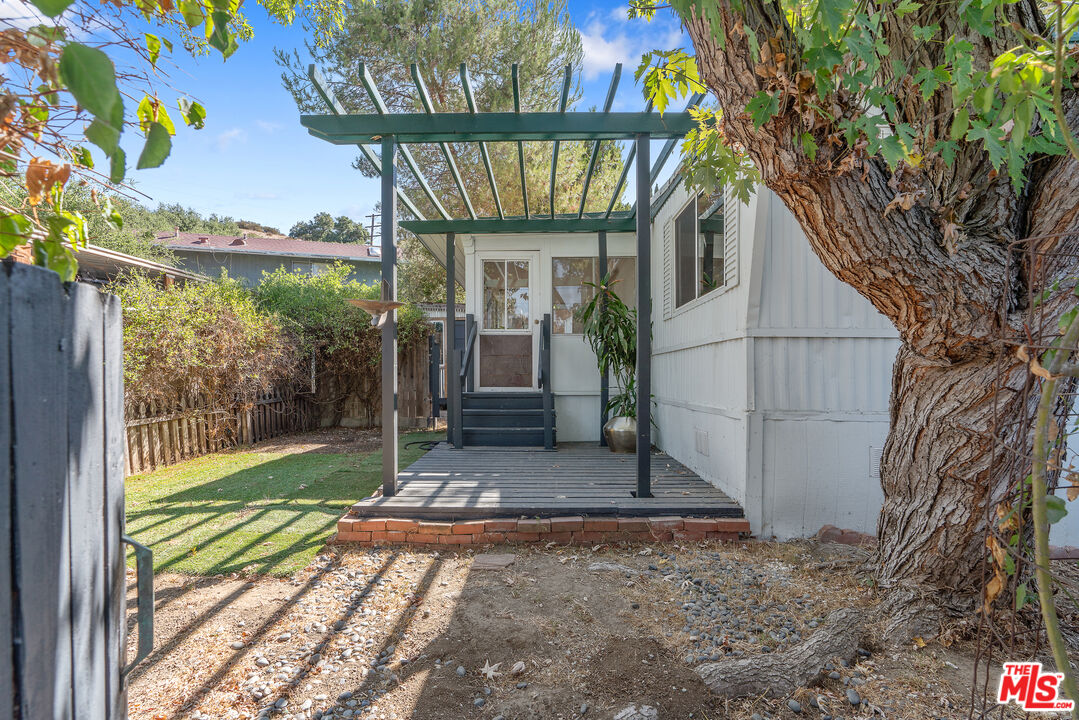 1667 Las Virgenes Canyon Road, Unit 9 Calabasas, CA 91302 - Photo 13 of 29 a view of a porch with a backyard