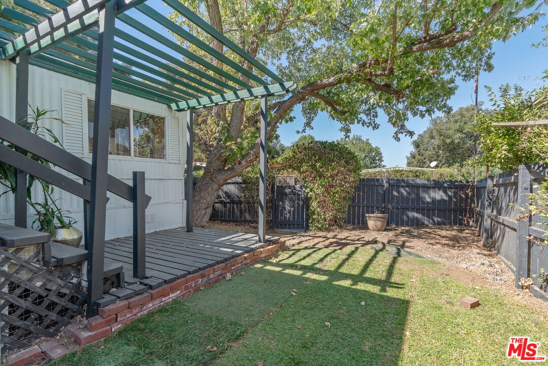 1667 Las Virgenes Canyon Road, Unit 9 Calabasas, CA 91302 - Photo 15 of 29 a view of outdoor space yard deck patio and outdoor seating